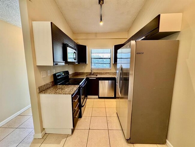 Building Photo - 11211 Royal Palm Blvd Unit 11211