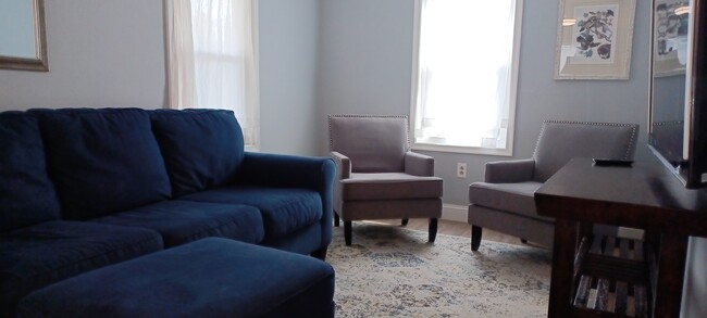 Comfy living room with 55' Smart TV - 820 Page St House