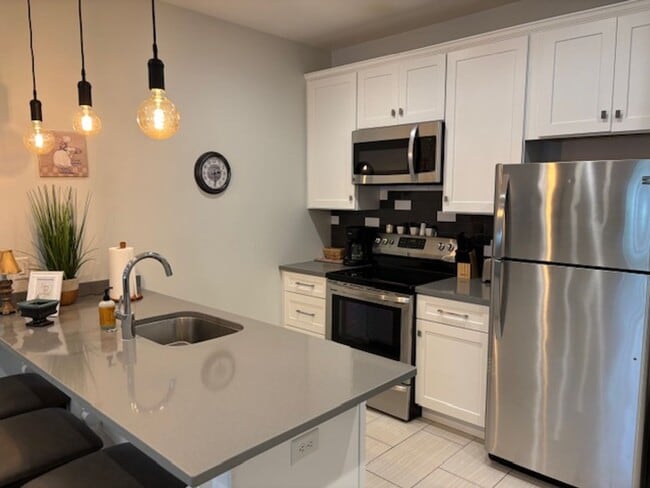 Photo - 2-bedroom 1 bath garage apartment with a garage parking space!!