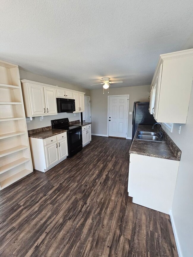 Photo - Spacious 3-Bedroom Home in Crossville with 2-Car Garage, Fenced Yard & Porches