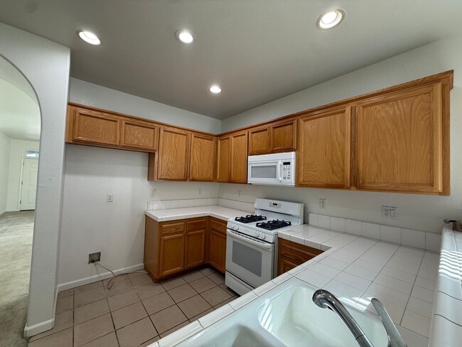 Photo - 4 Bed| 2 Bath | 1702 SF | 2 Car Garage | Single Story | Tenant pays $175 for WS&G.