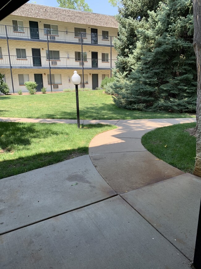 Looking at the court yard from front door - 5770 E Warren Ave Unit Jasmine condos 116C