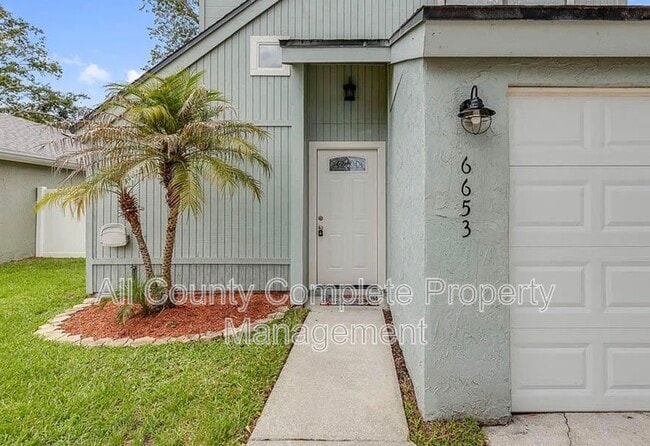 Building Photo - 6653 Periwinkle Dr