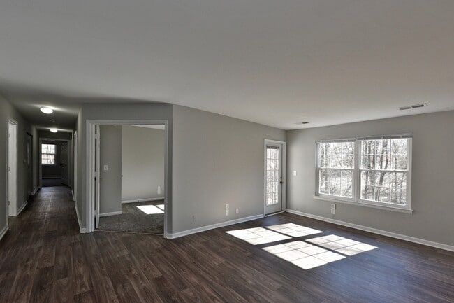 Spacious living room with hardwood-style flooring