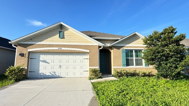Building Photo - Available NOW! Spacious 4BD/2BA Haven in Villages at Harmony – Your Dream Home Awaits! WASHER & D...