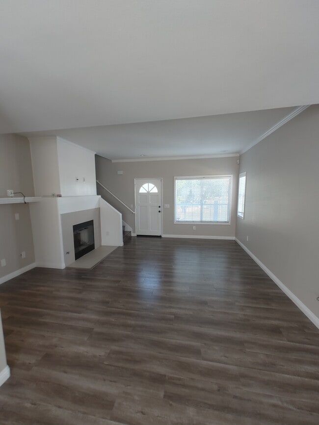 Living room/ Front door - 357 W Wilson St Unit Townhome #A