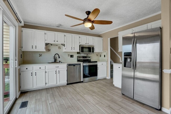 Building Photo - Spacious 4-Level Home with Deck, Workshop ...