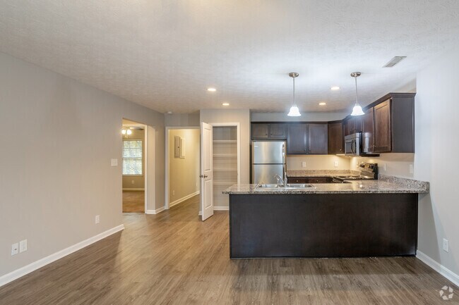 2BR, 1BA - 1,025 SF - Living Room & Kitchen - Six Mile Lane Apartments