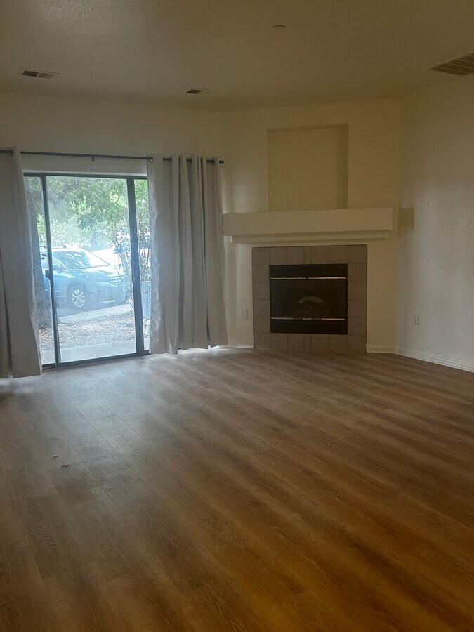 Living area easy access to patio - 7454 S Alkire St Unit 103