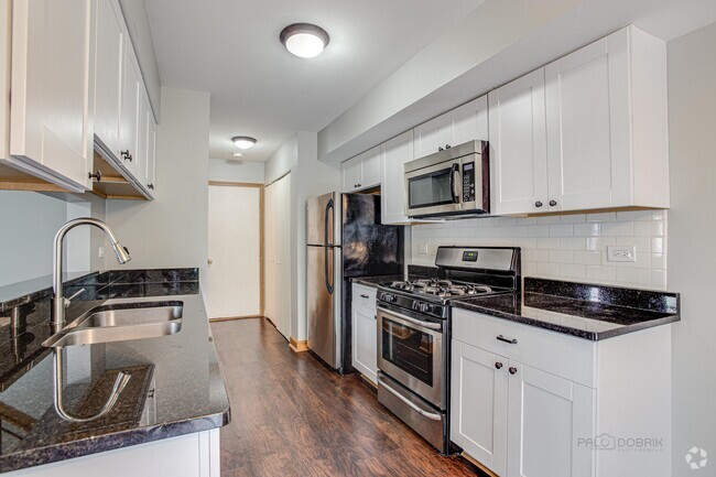 kitchen with granite counters and stainless a - 240 Acorn Dr Rental