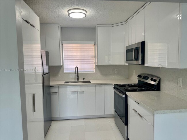 Building Photo - 7965 W 30th Ct Unit 210 Rental