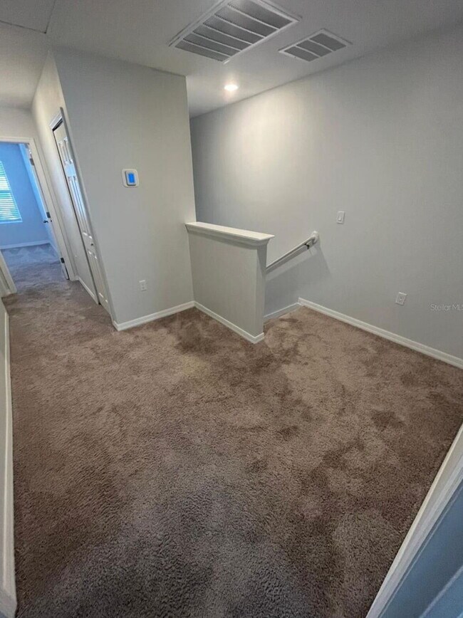 Photo - "Charming 3-Bed Townhouse with 2.5 Baths in St. Cloud's Serene Burrowing Owl Loop!"