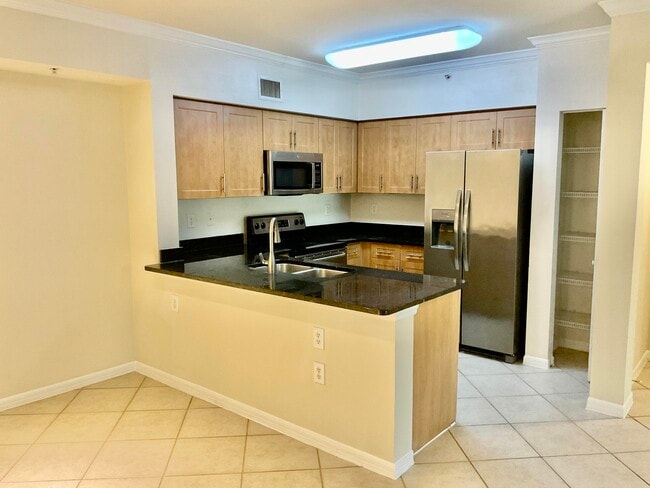 Building Photo - 6559 Emerald Dunes Dr Unit 205 Rental