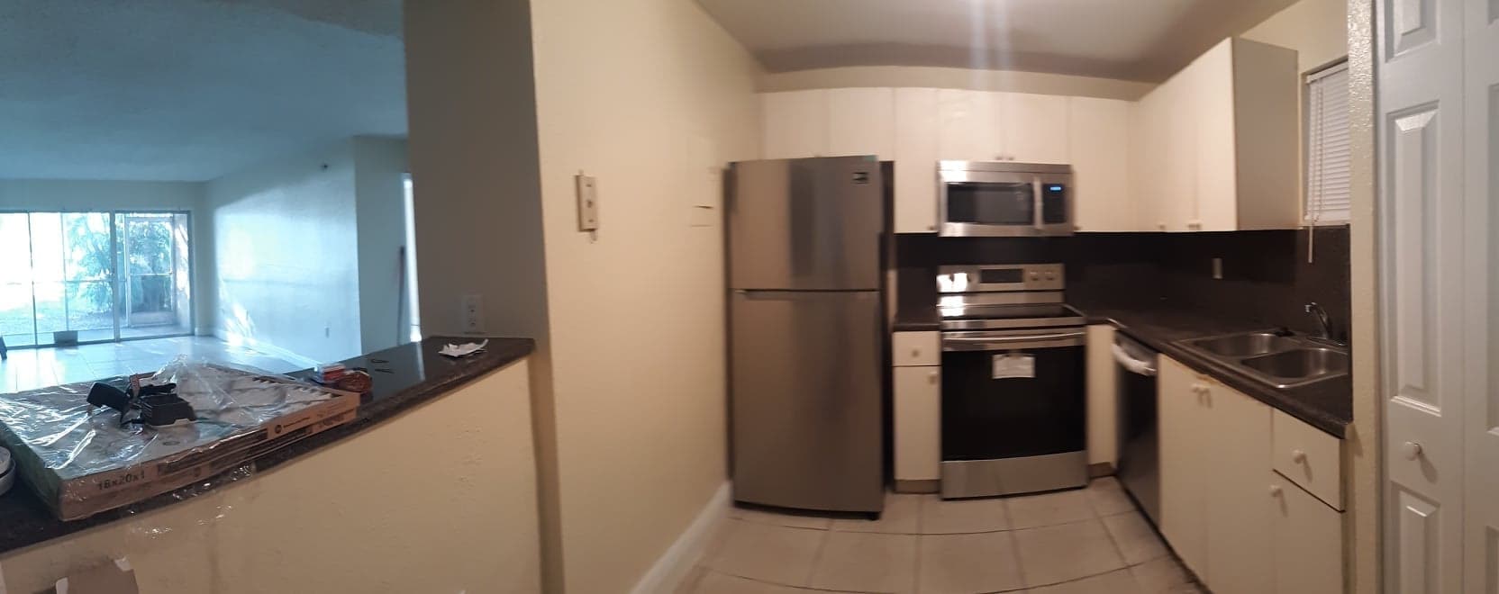 Kitchen and living room before upgrade - 4215 N University Dr Unit 101