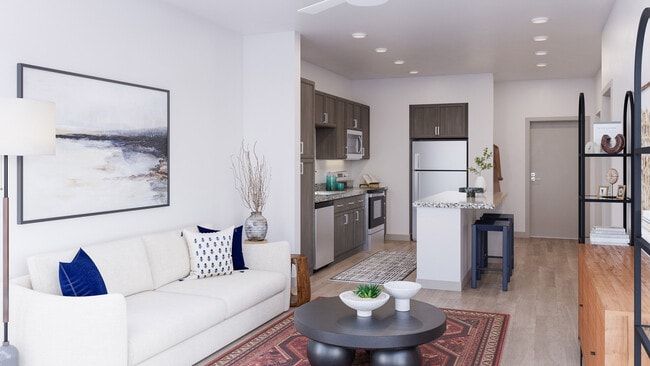 Modern open concept apartment with living room, kitchen island, neutral finishes, and contemporary furnishings for everyday comfort - Mesquite Trails at Brooks