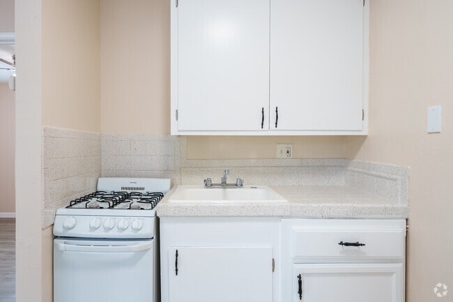 1BR, 1BA - 400SF with white counter top - Kitchen