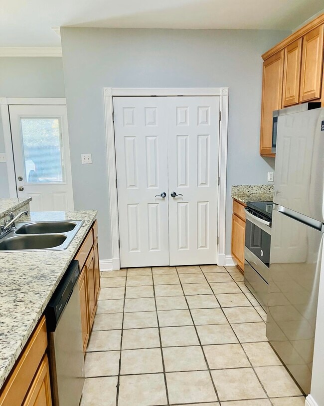 Washer/dryer hookups behind double doors - 1338 Tropical Cv