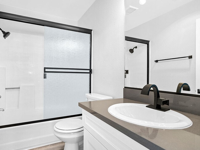 Modern styled bathroom with shower and tub.