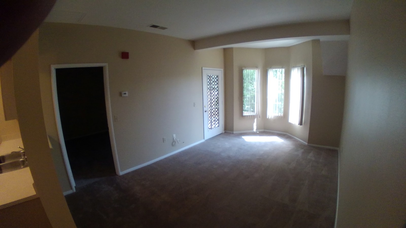 Living Room with small patio - 1121 Golden Ave Apartments Unit O