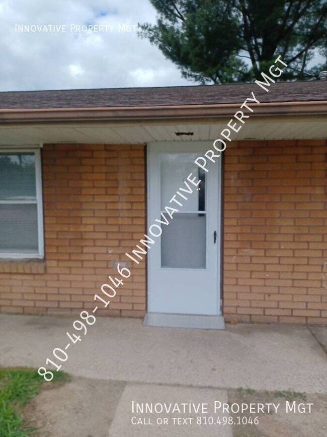 Building Photo - 7351 N Dort Hwy Unit 9
