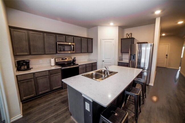Photo - Boasts 4 bedrooms with 2 baths on a premier lot. As you enter the home, you will be greeted with ...