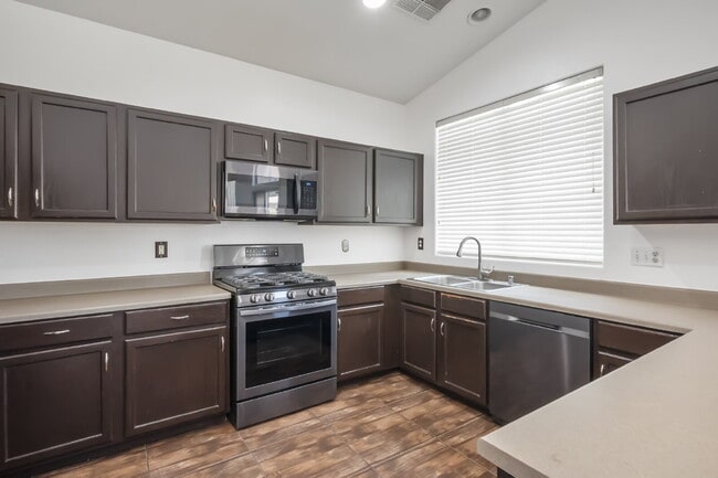 Charming single-story townhome featuring two bedrooms, two bathrooms, and an attached two-car gar...