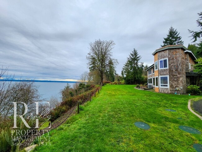 Building Photo - Waterfront Rustic Retreat with Vaulted Ceilings, Picture Windows & Lofted Nook