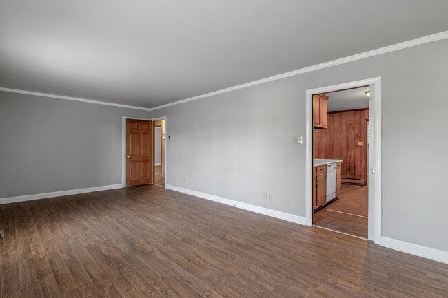 Photo - Large Brick Ranch, New Wood Like Flooring Throughout, Just Painted, LR, Den, Sun Room, Carport!