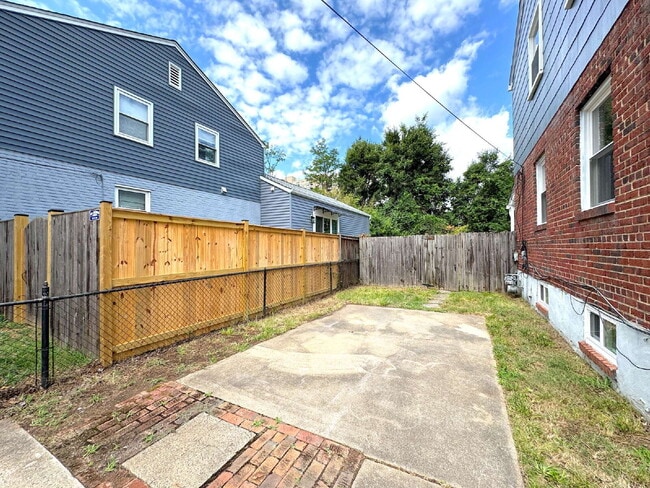Photo - Charming 2BR Townhome with Finished Basement, Fenced Yard & Private Driveway Near Huntington Metro