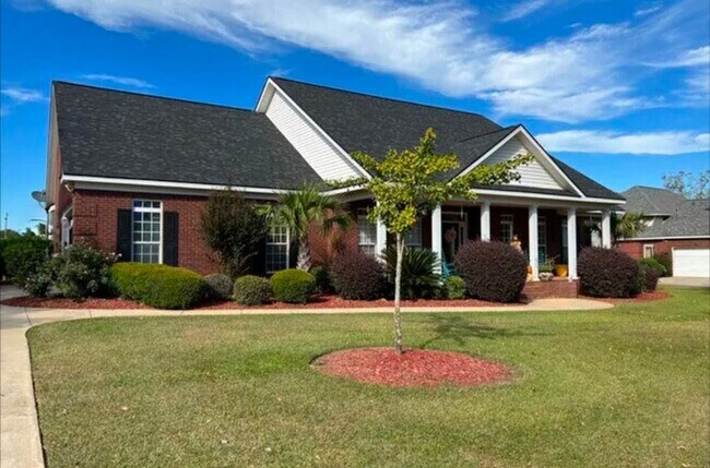 Photo - five bedrooms, five and a half bathrooms, a year-round heated swimming pool, and an ultimate back...