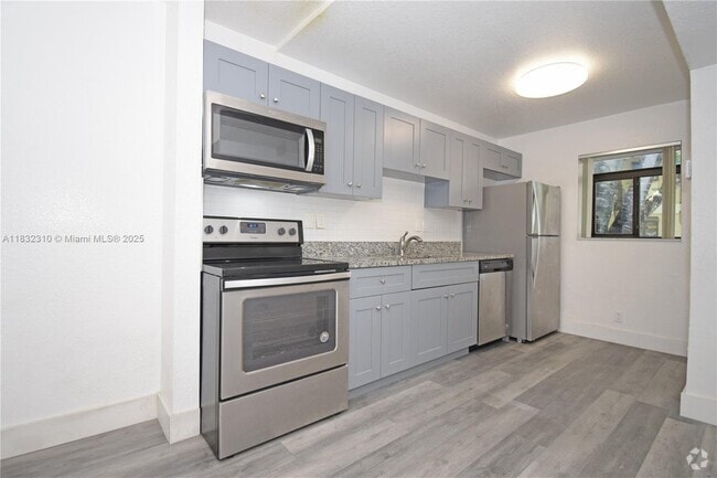 Building Photo - 301 Gardens Dr Unit 102 Rental