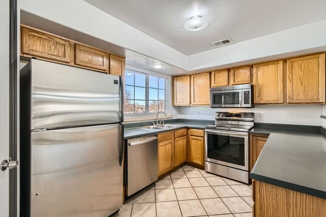 Photo - Modern 2-Bed Townhouse with Private En-Suites, Parking for 3 Cars  & Community Amenities