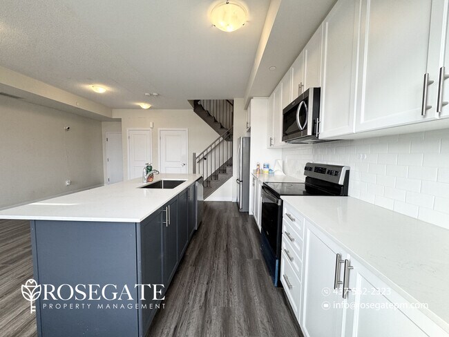 Photo - Modern 2-Bedroom Stacked Townhouse with Balcony & Parking in Milton Unit 121