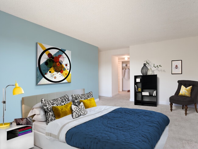 Bedroom with accent wall and carpeted flooring - Avalon at Foxhall