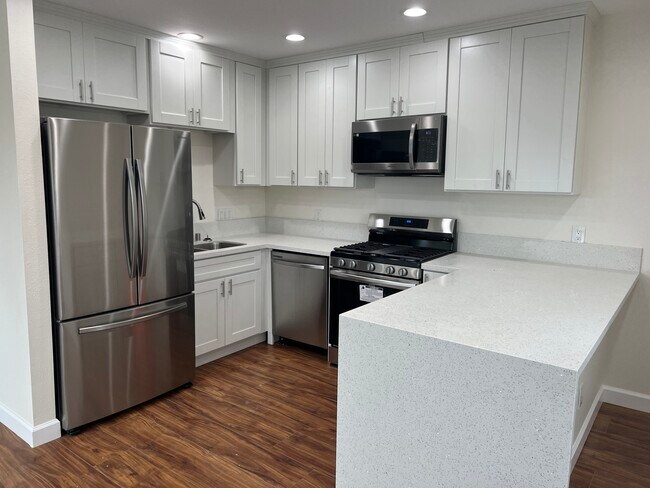 Waterfall-style counter with breakfast counter - 1618 E Romneya Dr Apartments Unit D