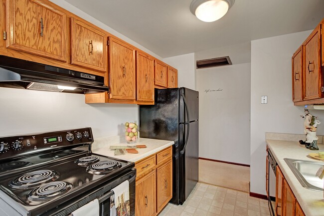 Sunset Ridge Kitchen View with Oven and Fridge - Sunset Ridge Apartments