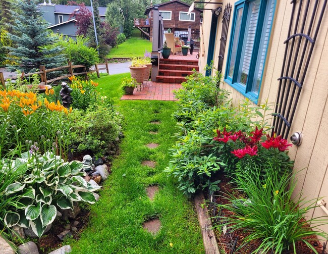 In law suite Entrance and bountiful floral garden - 2110 Tudor Hills Ct