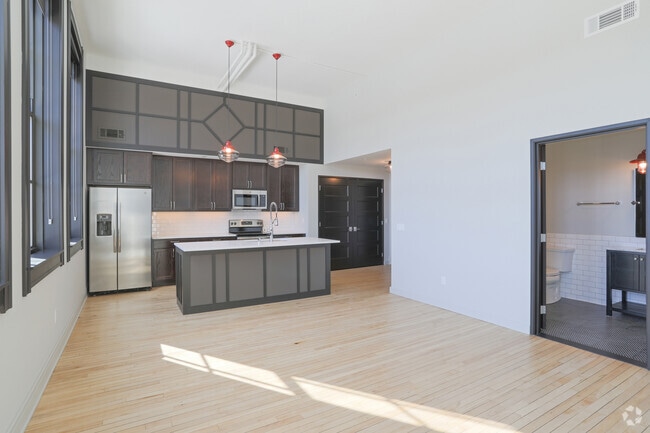 1 BR, 1 BA - Living Room/Kitchen - Whitney School Lofts