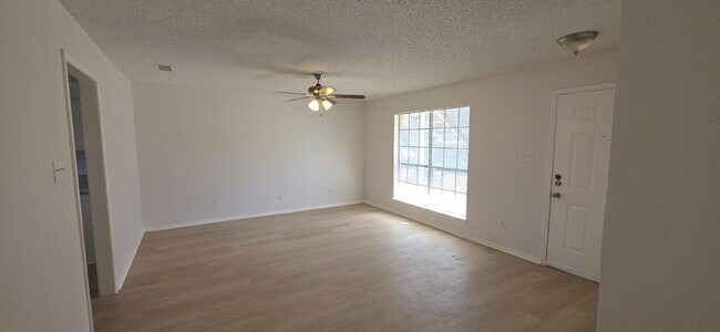 Building Photo - Beautifully remodeled first-floor condo with fence yard & carport!