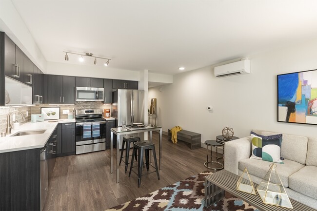 Air conditioning and luxury vinyl plank flooring throughout South Building apartments - Metro 112 Apartments