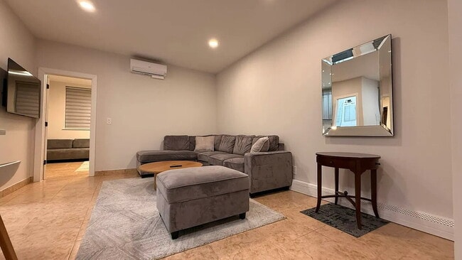 Photo - "Charming 1-Bedroom Furnished Apartment with Hardwood Floors in Queens – 750 Sq Ft of Comfort!"