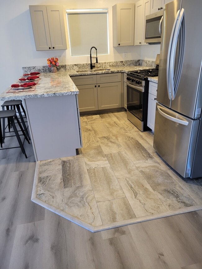 Custom tile in kitchen and bathrooms - 8396 E Stevens Dr Unit A