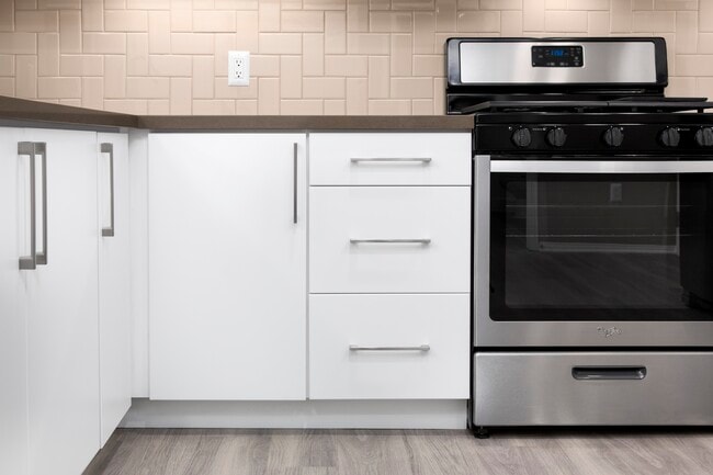 Newly renovated Design Scheme I kitchen with tile backsplash