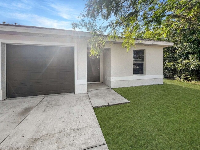 Photo - Sweater Weather Optional: 3 Beds, 2 Baths, and 1161 Sq Ft of Comfort in Lehigh Acres! Apply by 11...