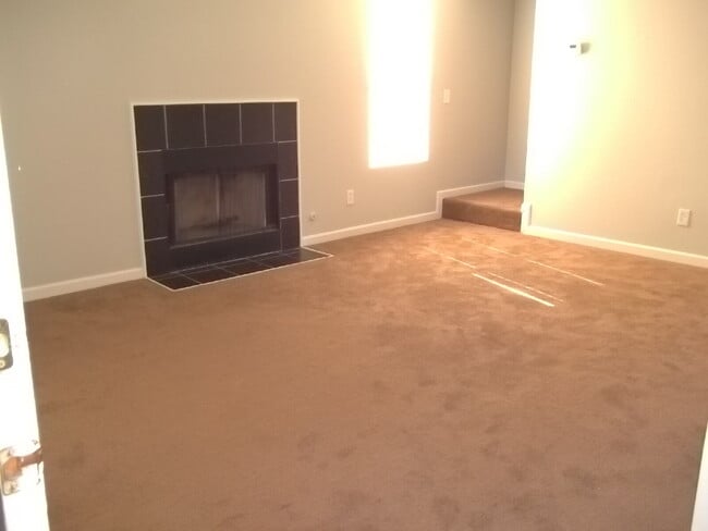 Photo - Freshly painted and new flooring in this 4 Bedroom 2 and Half Bath home. Covered front porch with...
