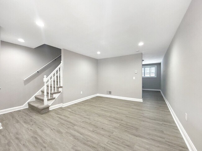 Photo - Updated 3BR Home with Bonus Lower-Level Space & Off-Street Parking