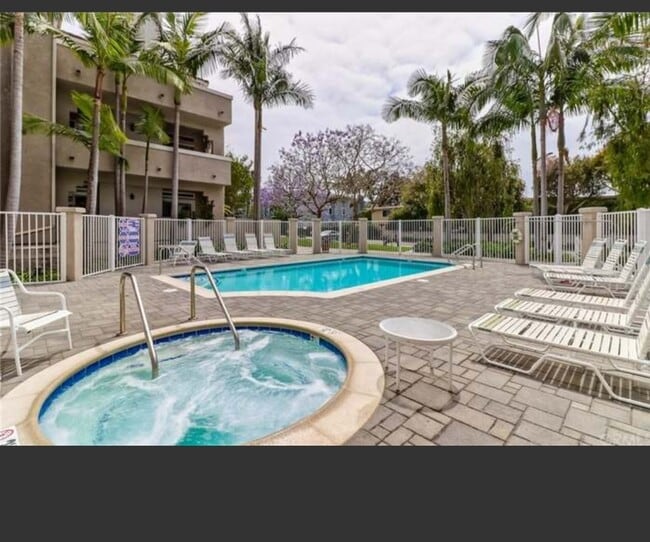 Building Photo - 4581 Warner Ave Unit 205