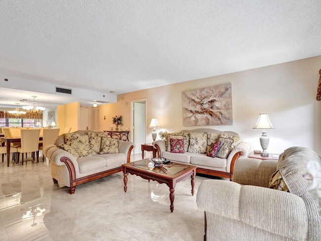 Building Photo - 3200 Port Royale Dr S Unit 208