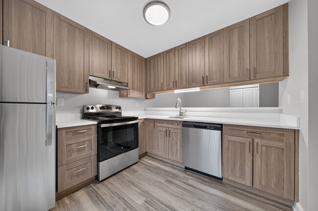 Stainless steel appliances and soft-close cabinets at Park Lane Apartments in Southfield, MI.