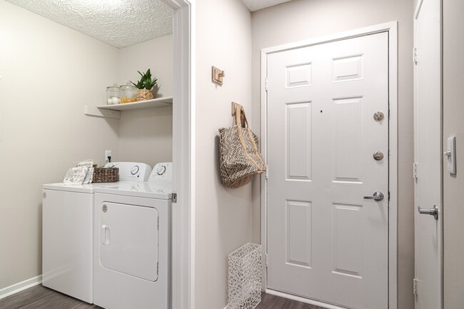 In home laundry room with side by side washer and dryer